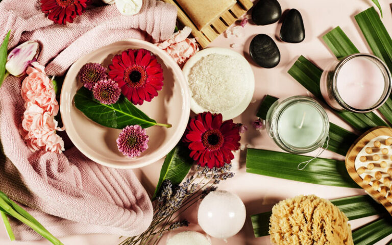 Table with a display of natural looking skincare products.