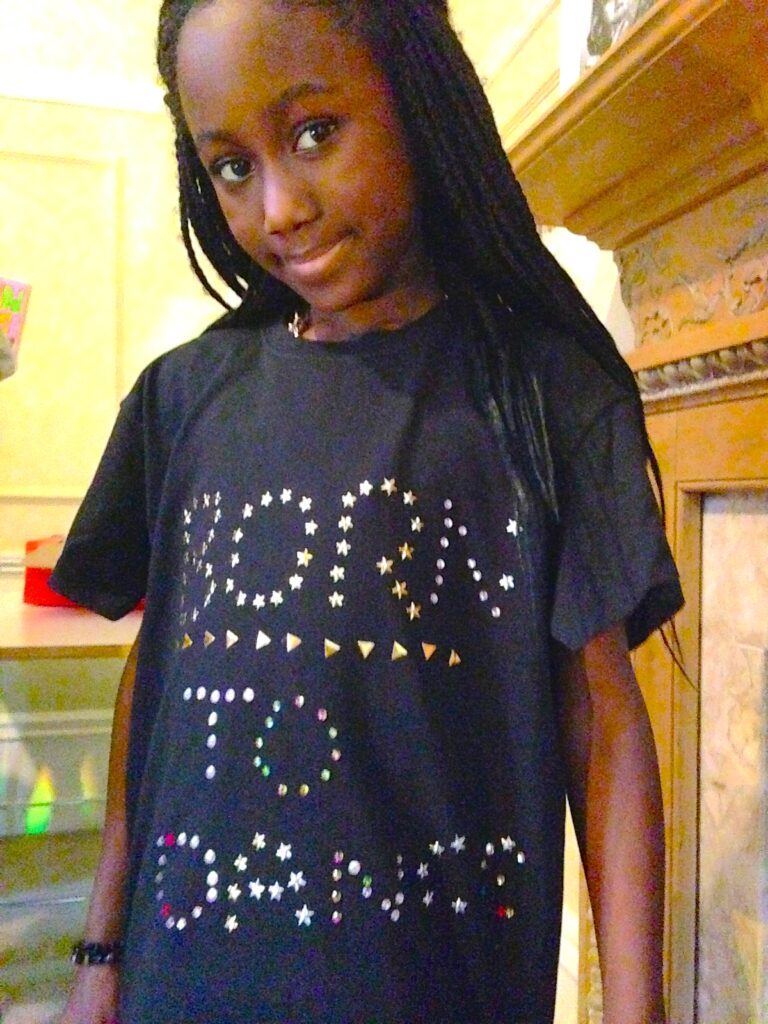 Girl wearing t-shirt that she designed